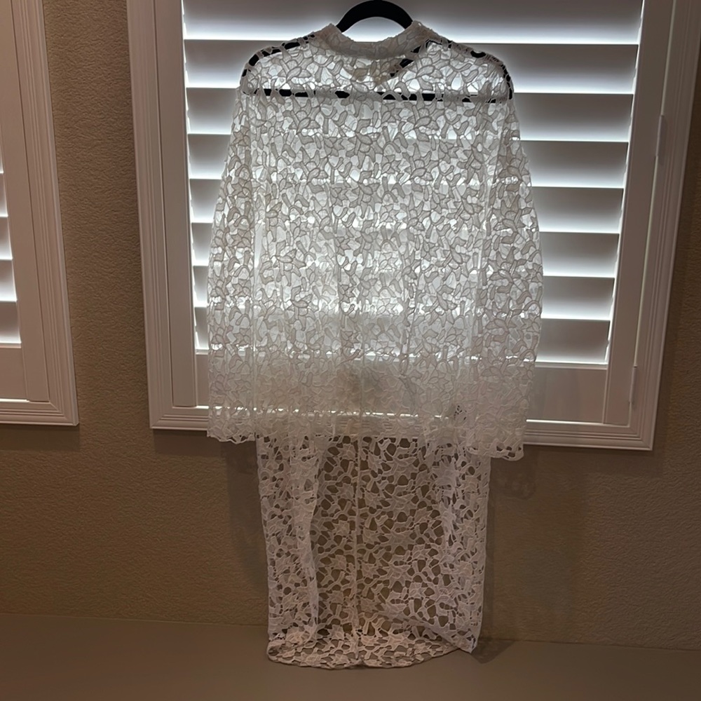 High low shirt, cute with anything from dress up to dress down!  Worn once
